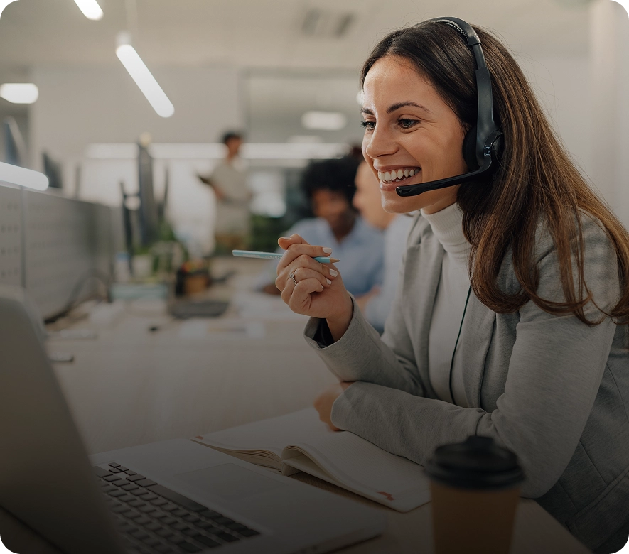 Woman with headset working in office.