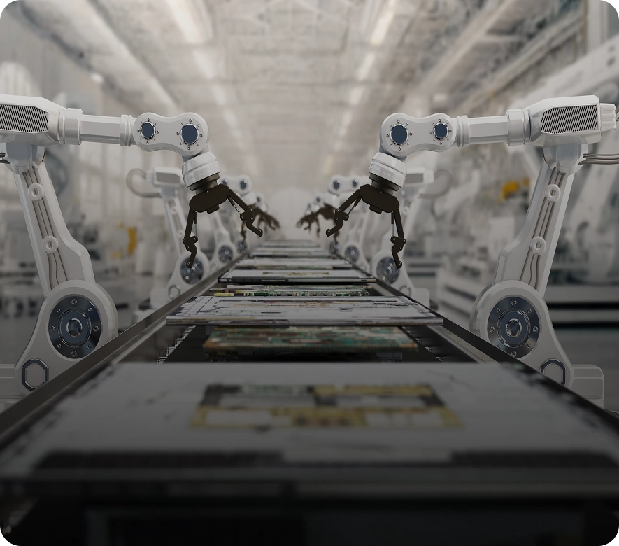 Robotic arms working on assembly line.