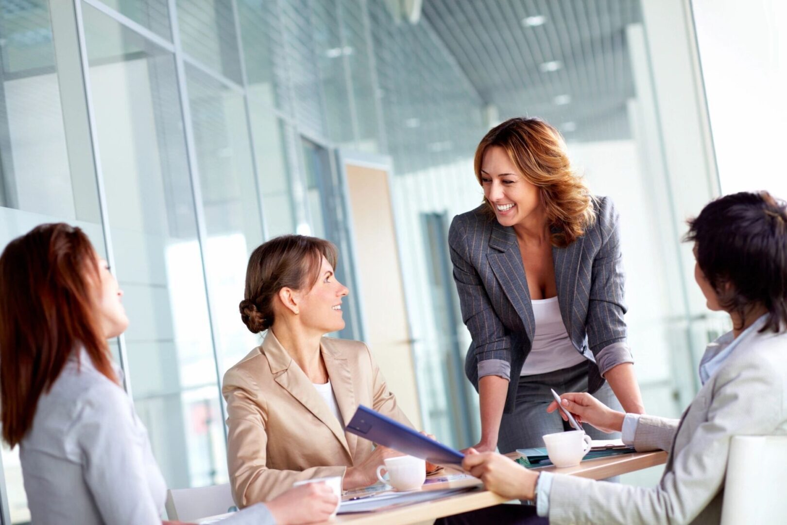 Three professionals engaged in a discussion in a modern office.